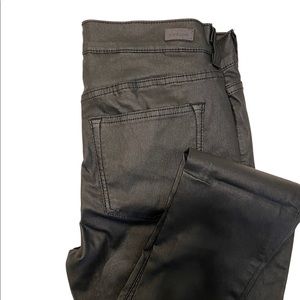 Sneak Peek coated black skinny denim.